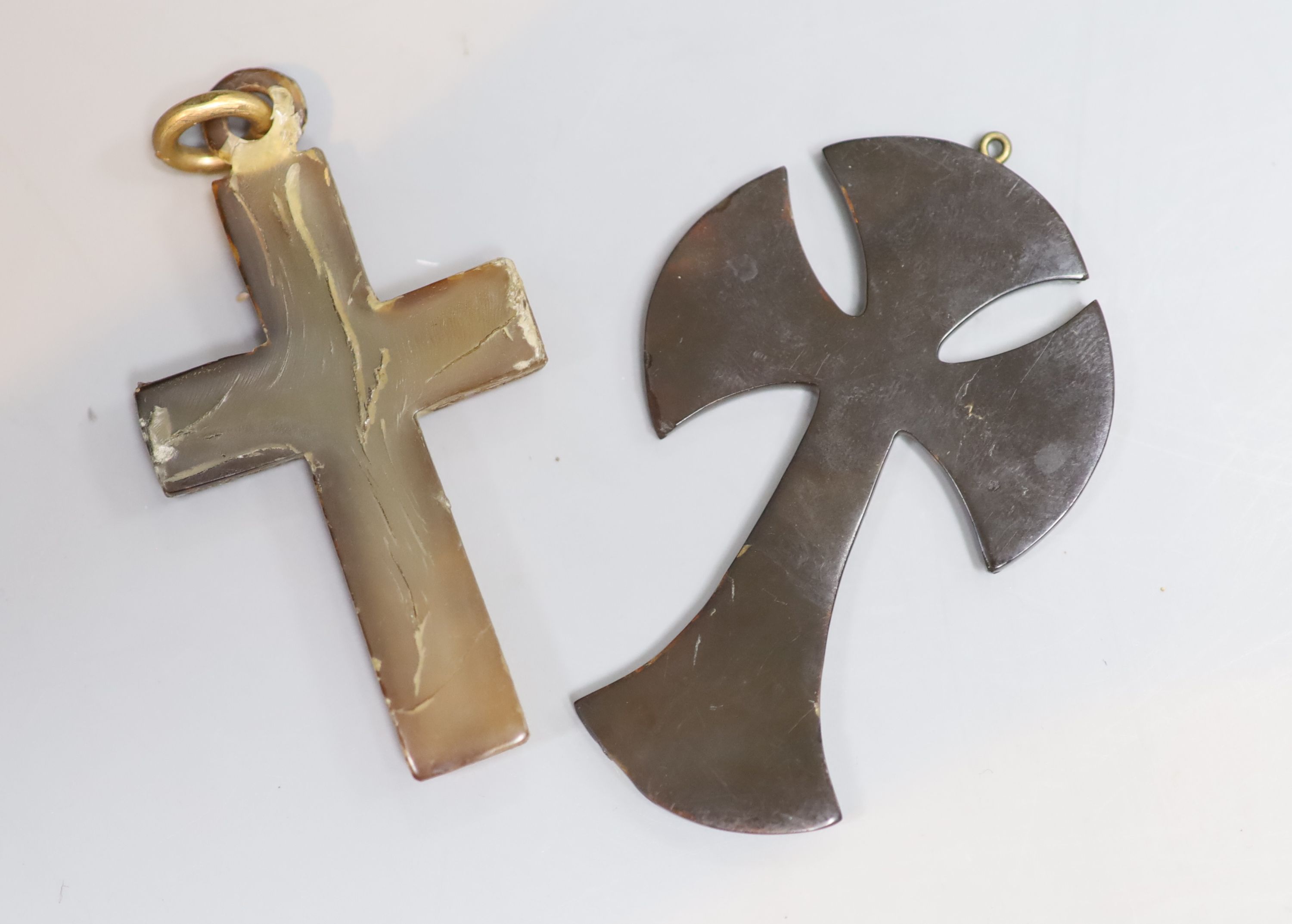 Two late 19th/early 20th century tortoiseshell and pique cross pendants